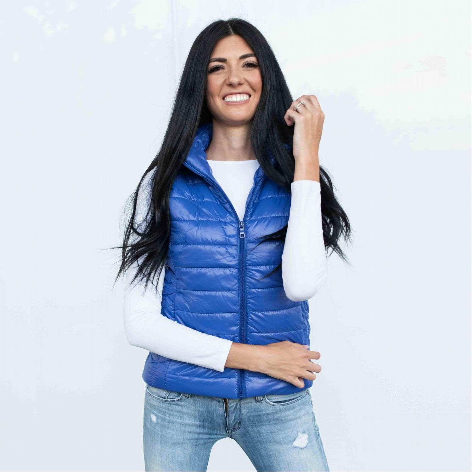 Chic quilted padded vest in shiny metallic finish, perfect for fall layering.