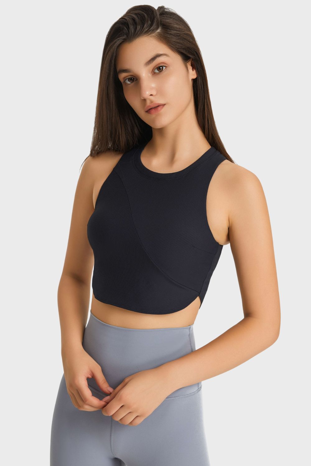 Racerback Hem Detail Sports Bra in solid color, showcasing its sleek design and removable padding.