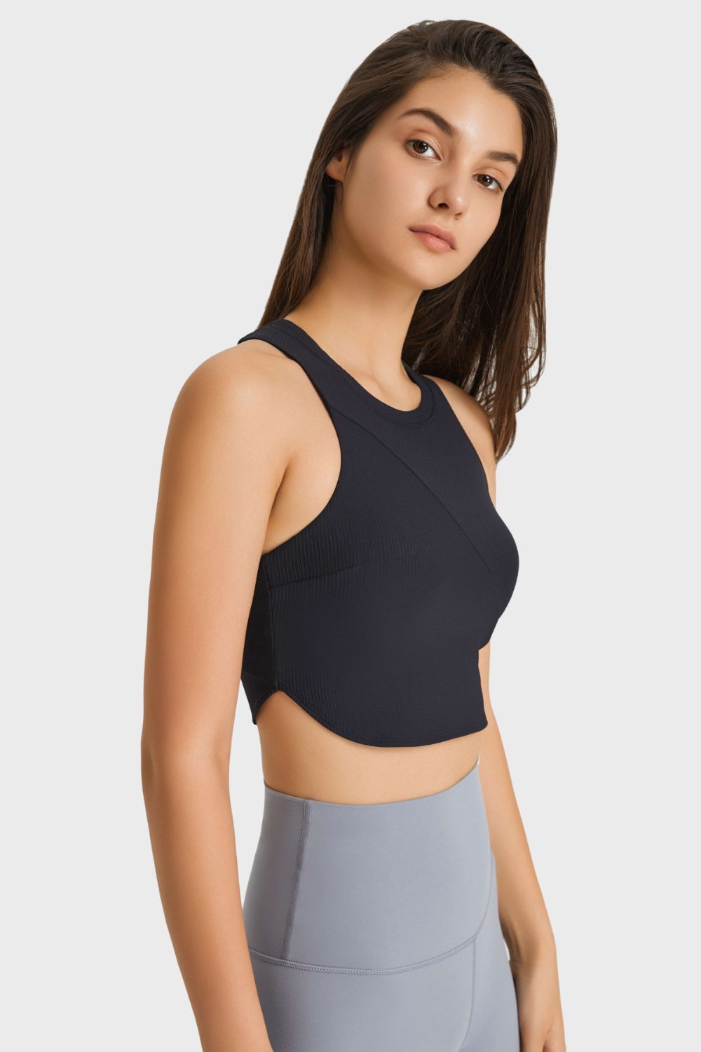 Racerback Hem Detail Sports Bra in solid color, showcasing its sleek design and removable padding.