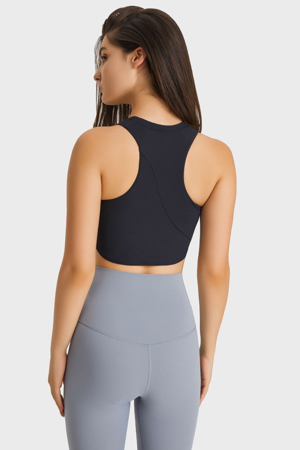 Racerback Hem Detail Sports Bra in solid color, showcasing its sleek design and removable padding.