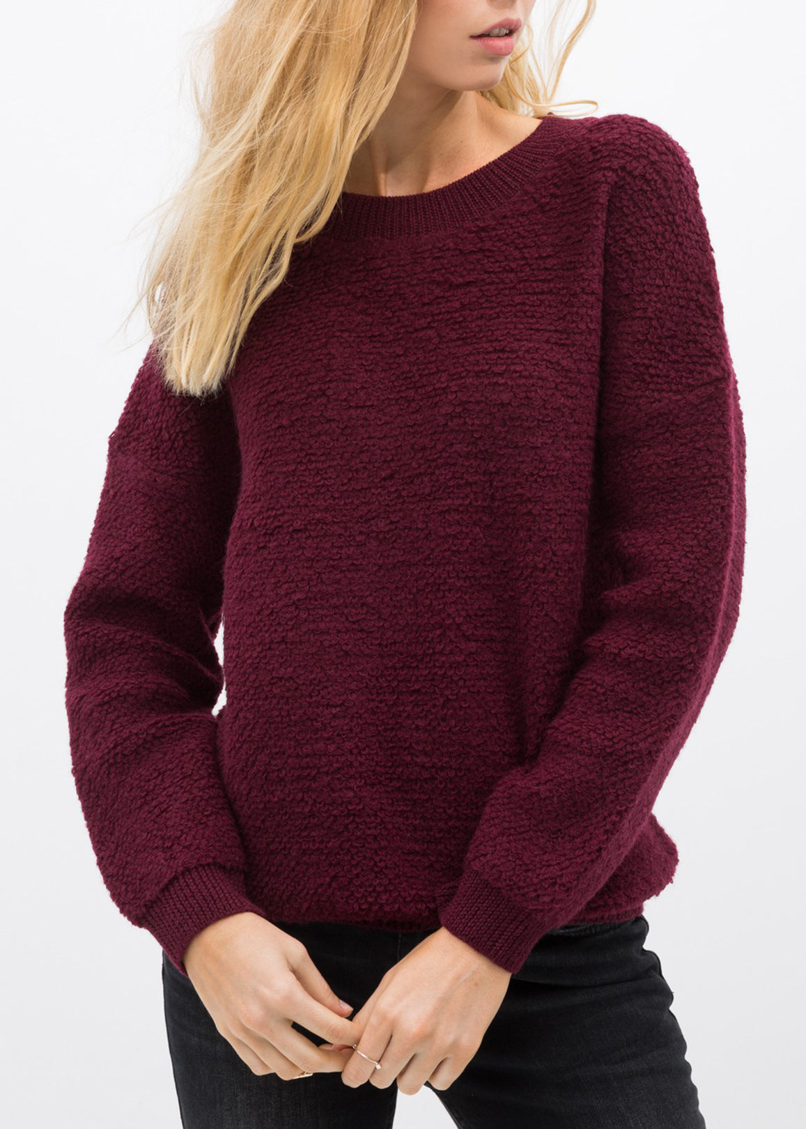 A cozy women's rag wool knit crew neck sweater in a classic design, showcasing its soft texture and warm fabric, perfect for winter wear.