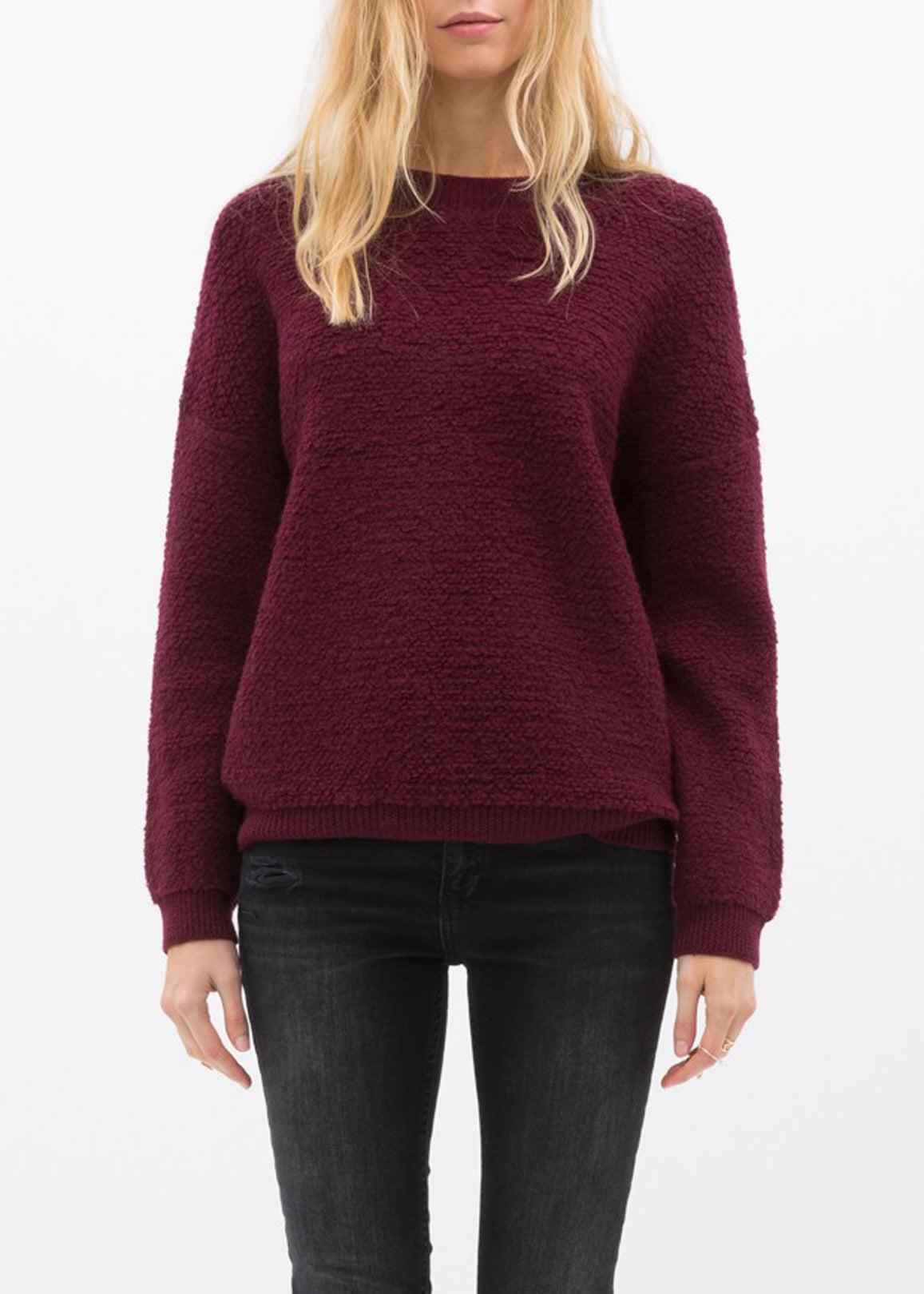 A cozy women's rag wool knit crew neck sweater in a classic design, showcasing its soft texture and warm fabric, perfect for winter wear.