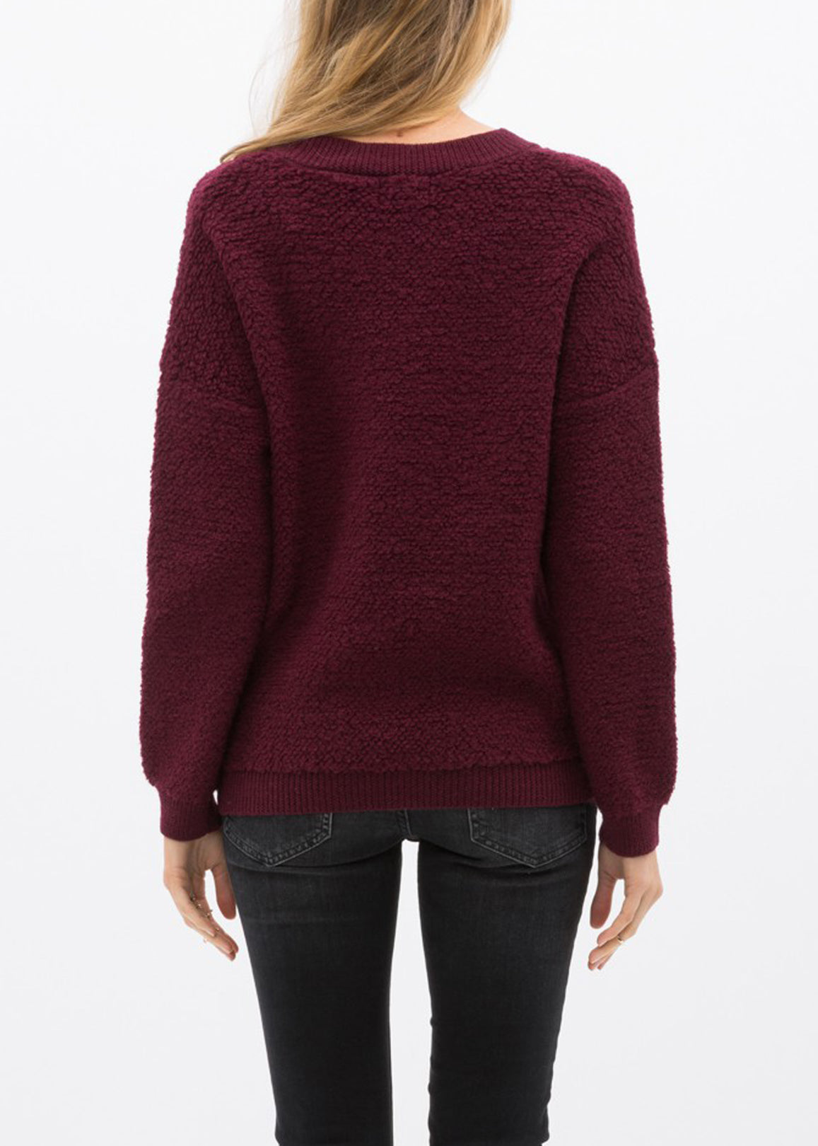 A cozy women's rag wool knit crew neck sweater in a classic design, showcasing its soft texture and warm fabric, perfect for winter wear.