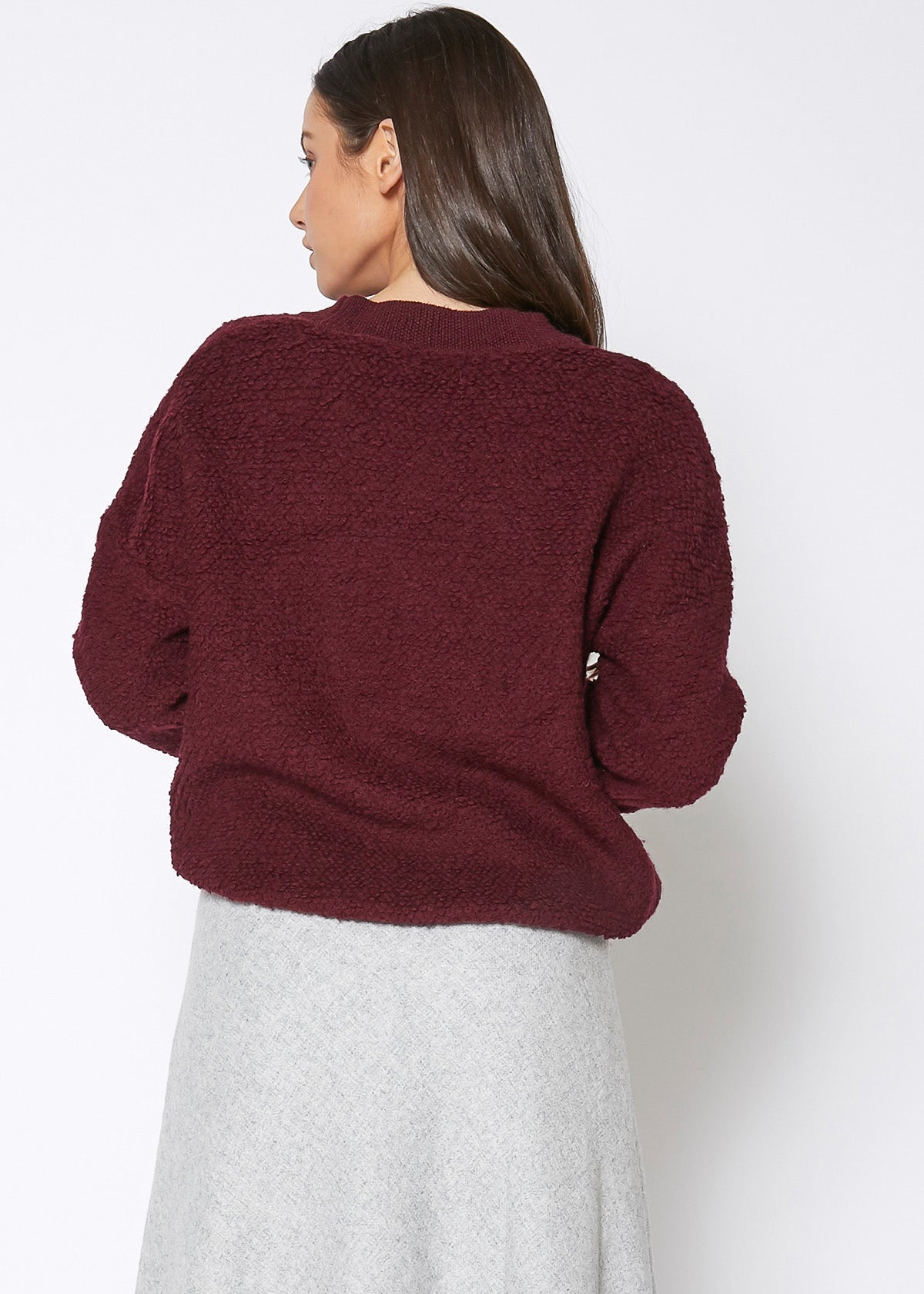 A cozy women's rag wool knit crew neck sweater in a classic design, showcasing its soft texture and warm fabric, perfect for winter wear.