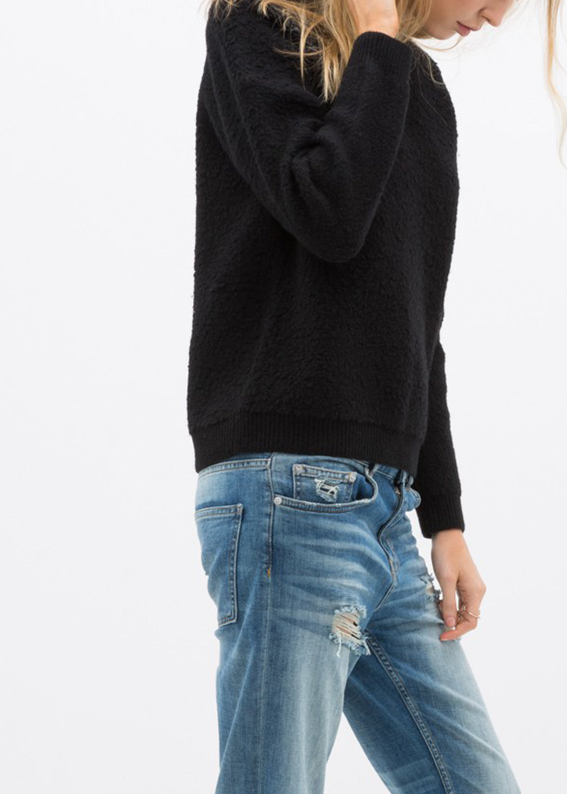 A cozy women's rag wool knit crew neck sweater in a classic design, showcasing its soft texture and warm fabric, perfect for winter wear.