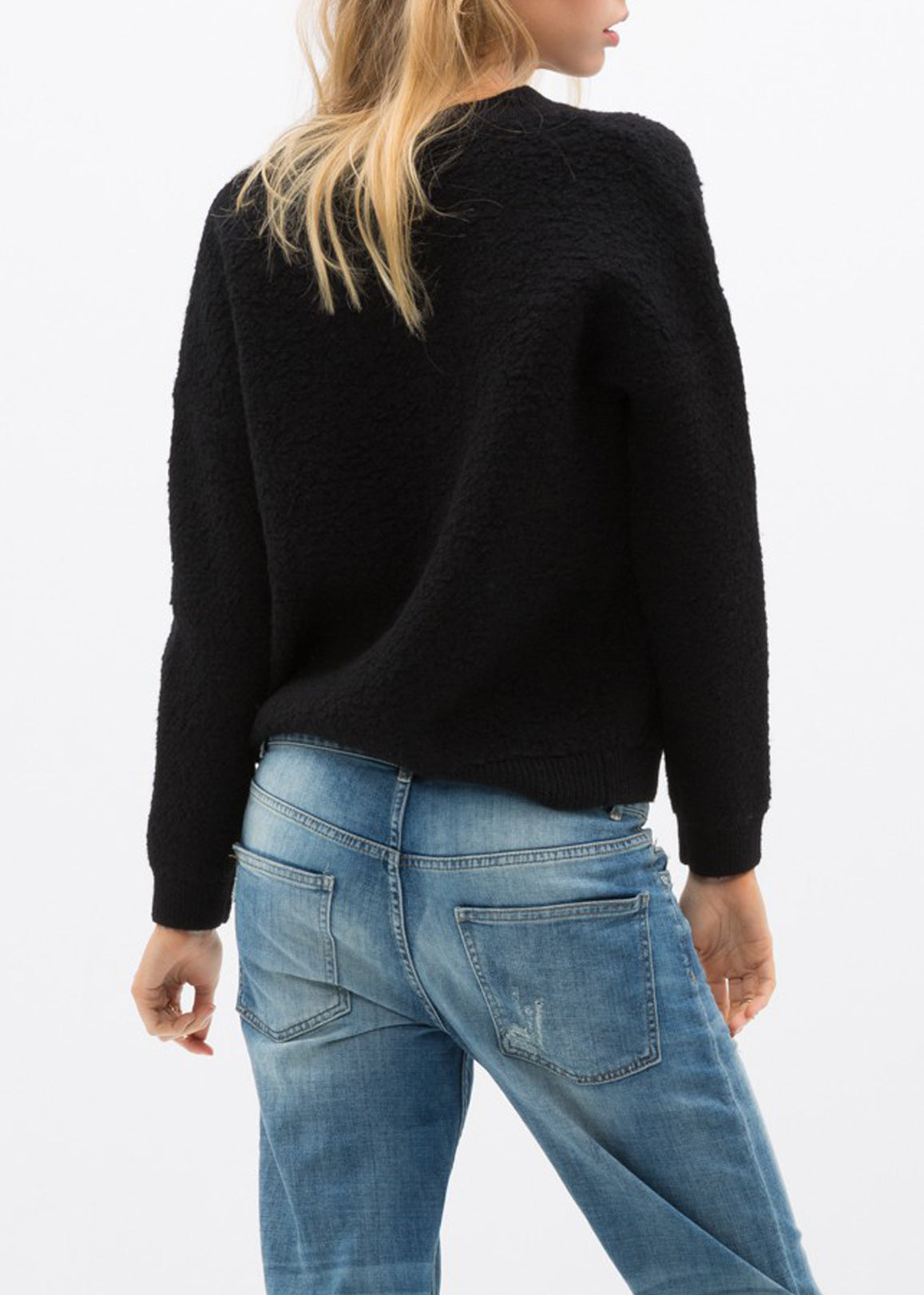 A cozy women's rag wool knit crew neck sweater in a classic design, showcasing its soft texture and warm fabric, perfect for winter wear.