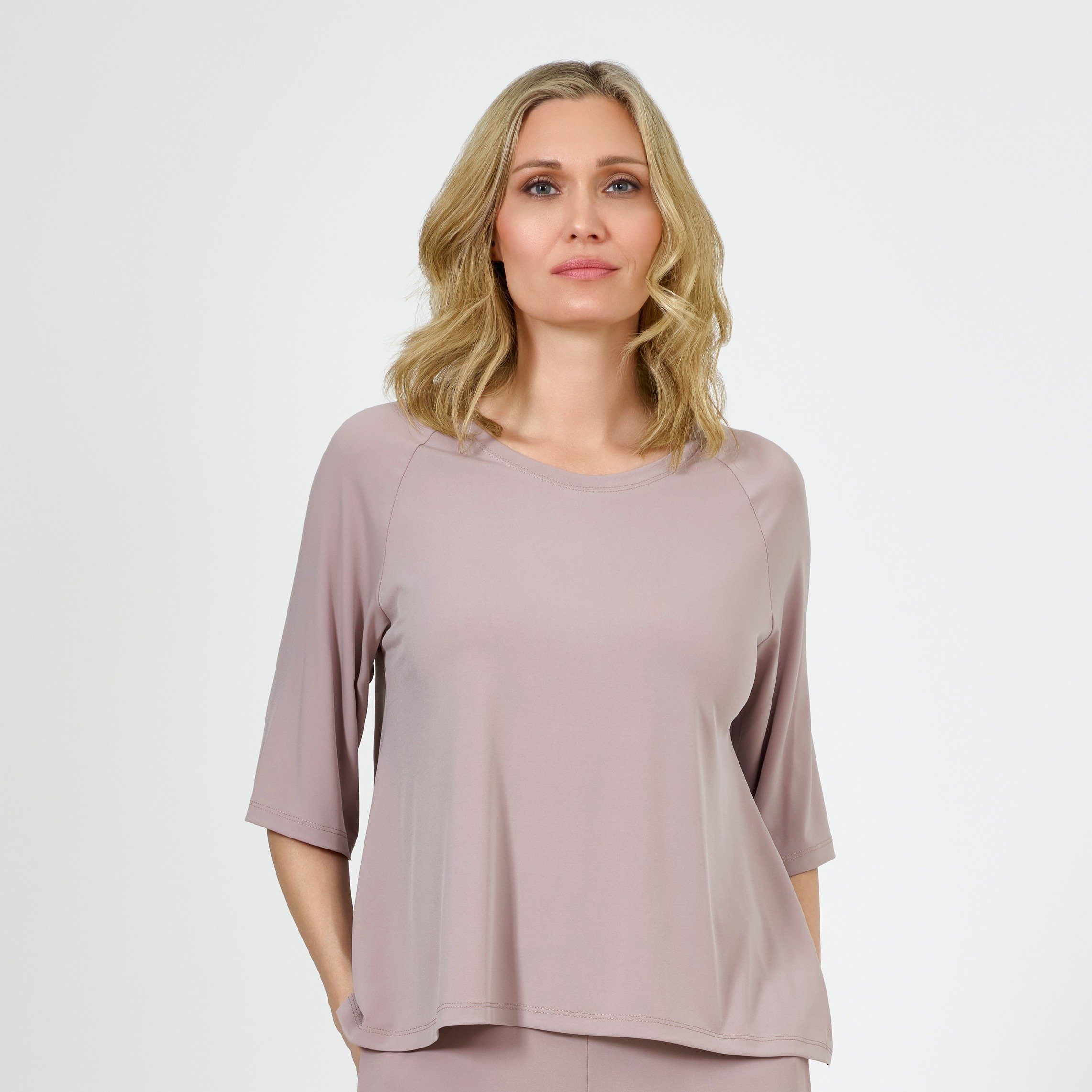 A stylish Raglan Kimono Top featuring a relaxed fit, made from a soft polyester and spandex blend, available in various colors.