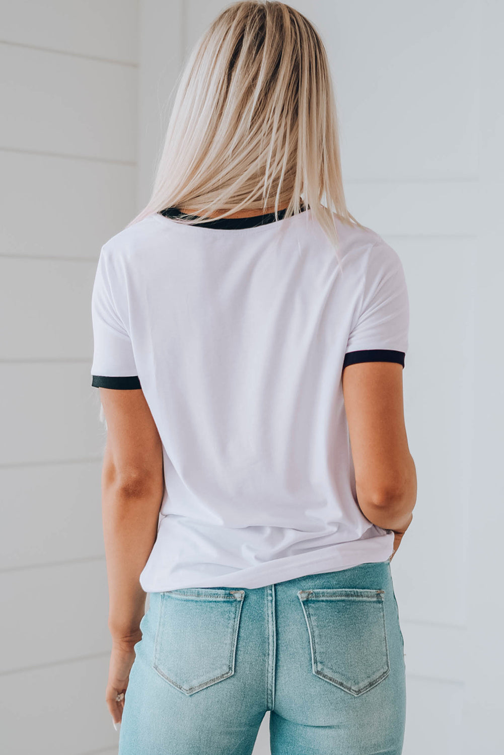 A colorful rainbow graphic short sleeve tee displayed on a mannequin, showcasing its casual style and round neckline.