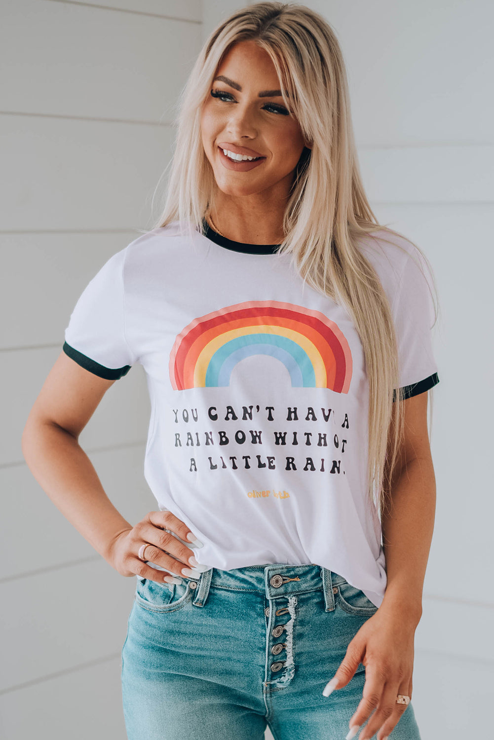 A colorful rainbow graphic short sleeve tee displayed on a mannequin, showcasing its casual style and round neckline.