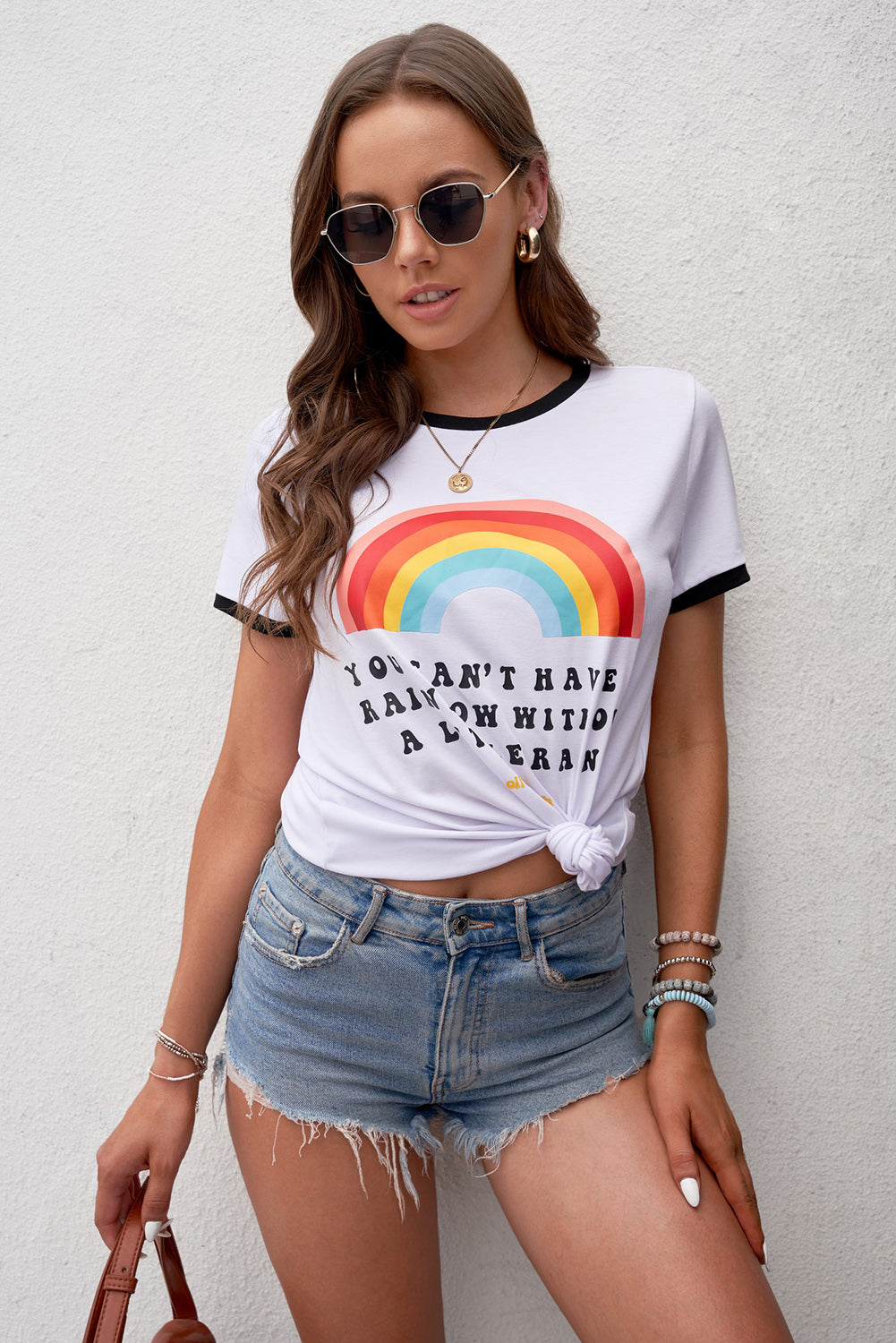 A colorful rainbow graphic short sleeve tee displayed on a mannequin, showcasing its casual style and round neckline.