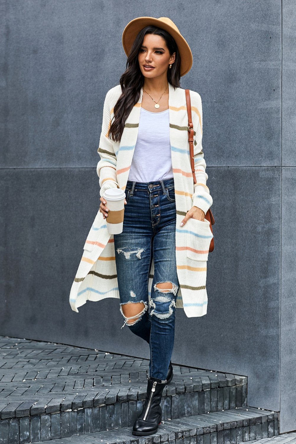 A cozy Rainbow Striped Cardigan featuring vibrant colors and a soft knitted texture, perfect for layering in any season.