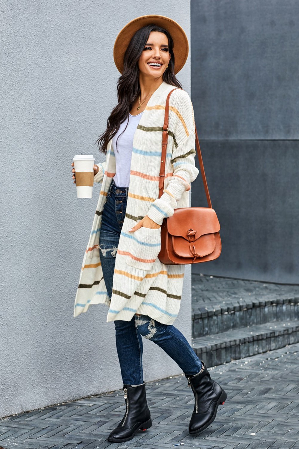 A cozy Rainbow Striped Cardigan featuring vibrant colors and a soft knitted texture, perfect for layering in any season.