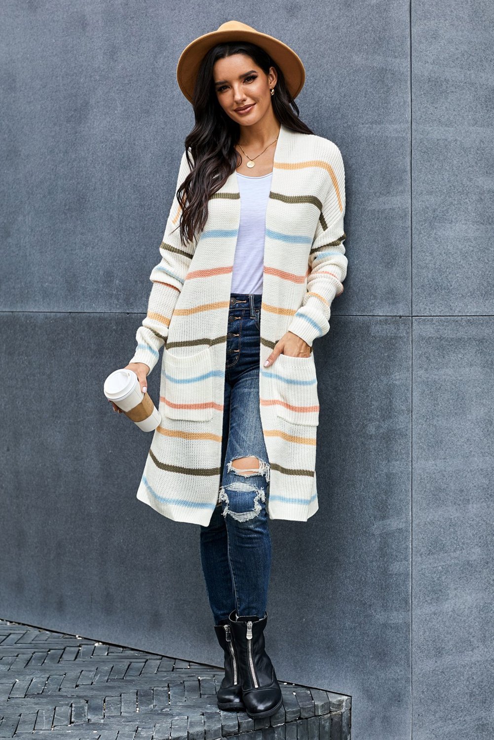 A cozy Rainbow Striped Cardigan featuring vibrant colors and a soft knitted texture, perfect for layering in any season.