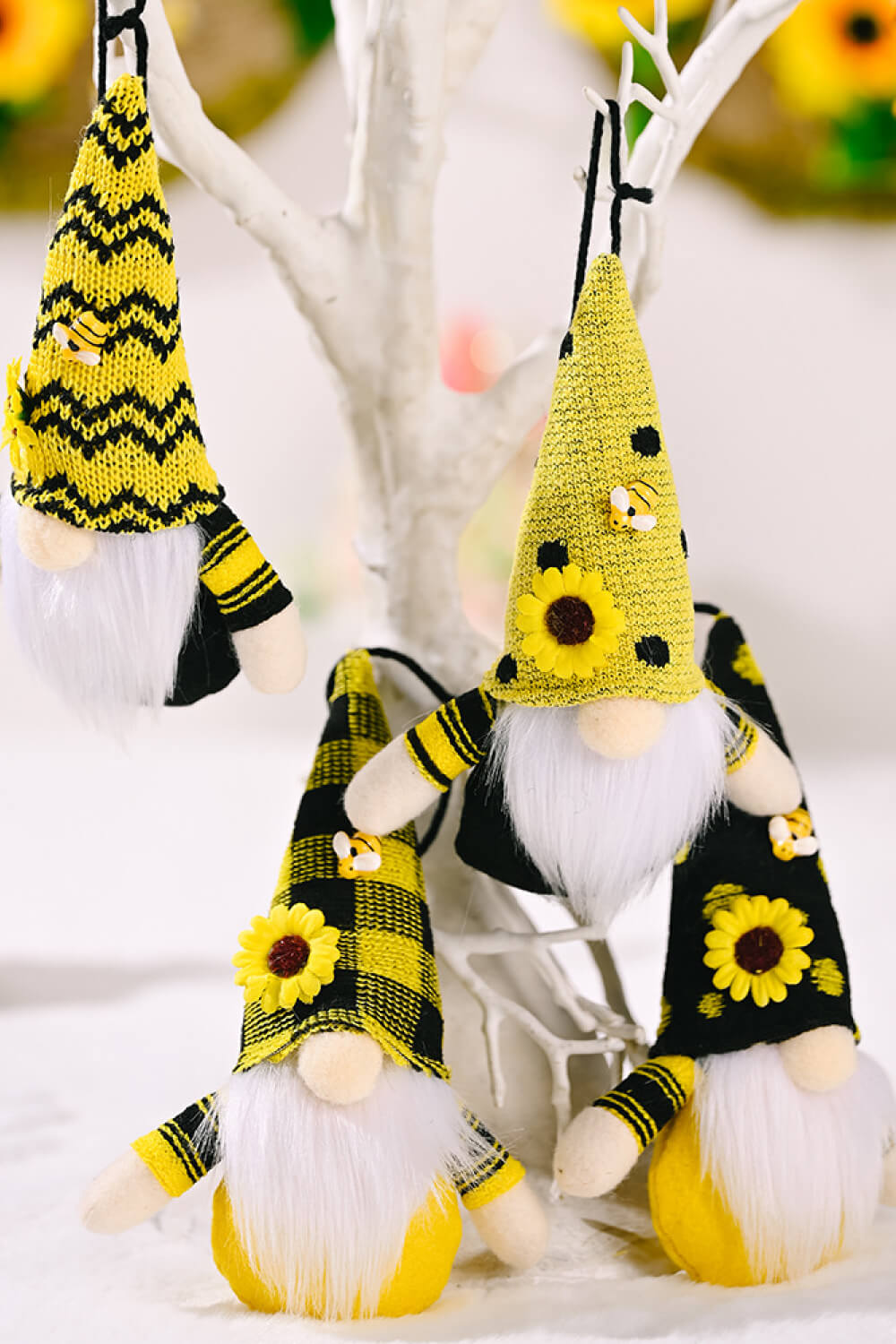 A colorful set of four sunflower faceless gnome hanging widgets, showcasing their whimsical design and vibrant colors.