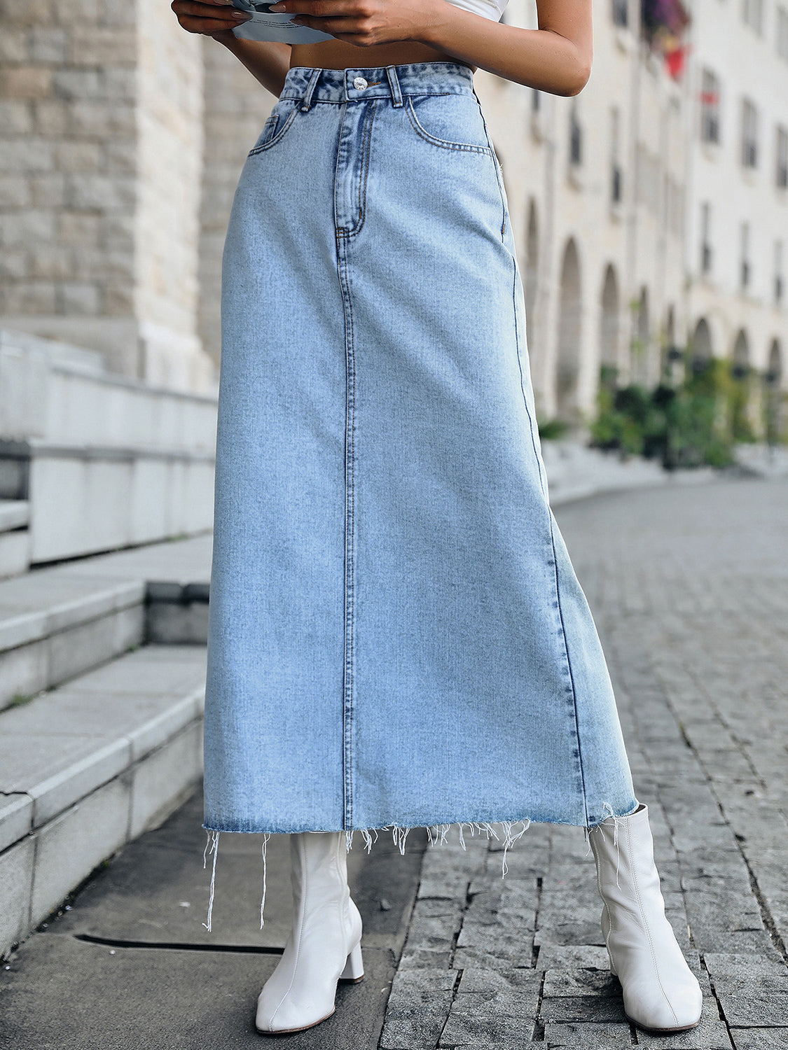 A stylish Raw Hem Denim Skirt featuring a trendy raw hem design, made from a soft cotton-polyester blend, perfect for casual wear.