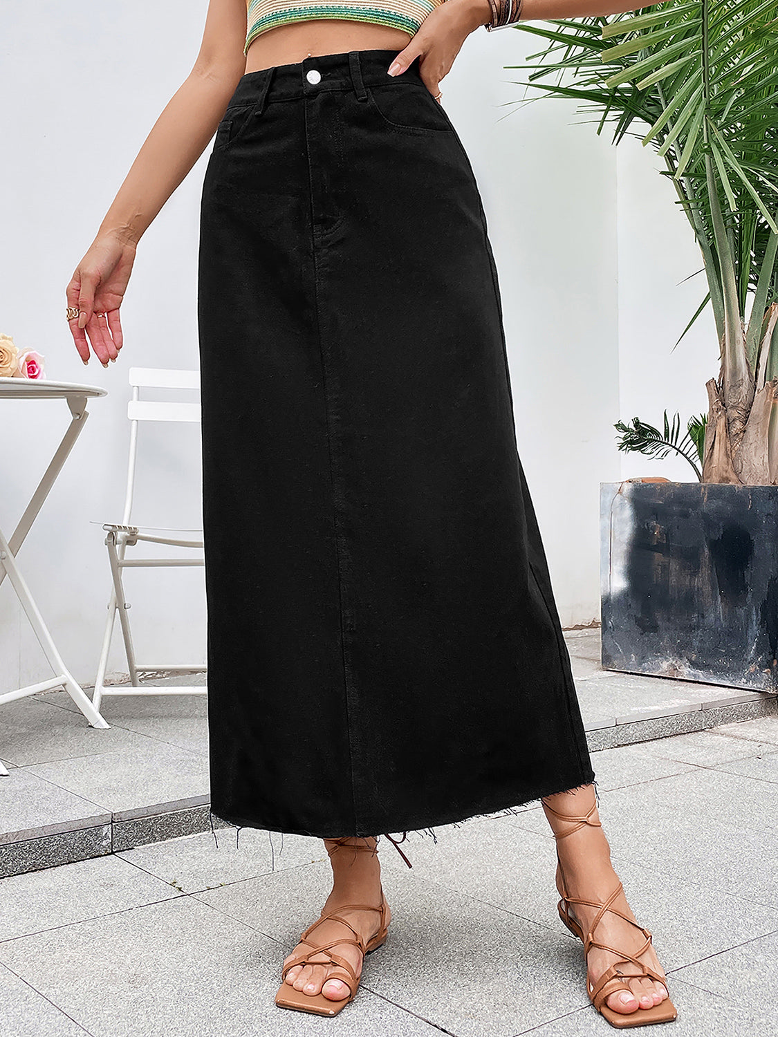 A stylish Raw Hem Denim Skirt featuring a trendy raw hem design, made from a soft cotton-polyester blend, perfect for casual wear.