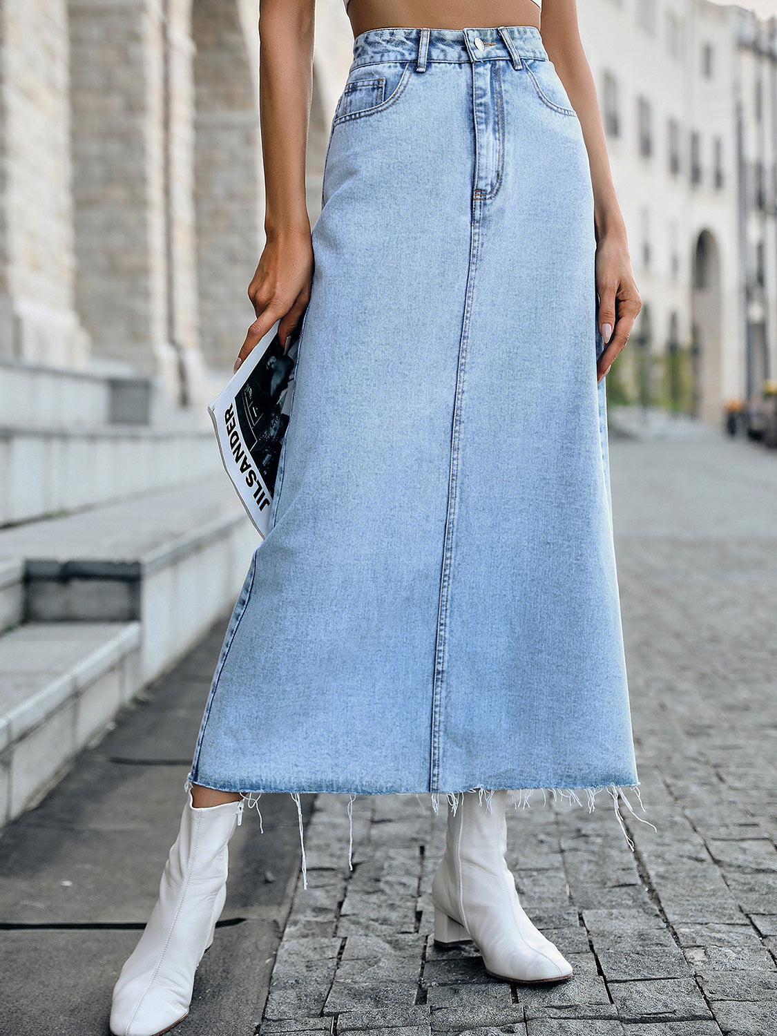 A stylish Raw Hem Denim Skirt featuring a trendy raw hem design, made from a soft cotton-polyester blend, perfect for casual wear.