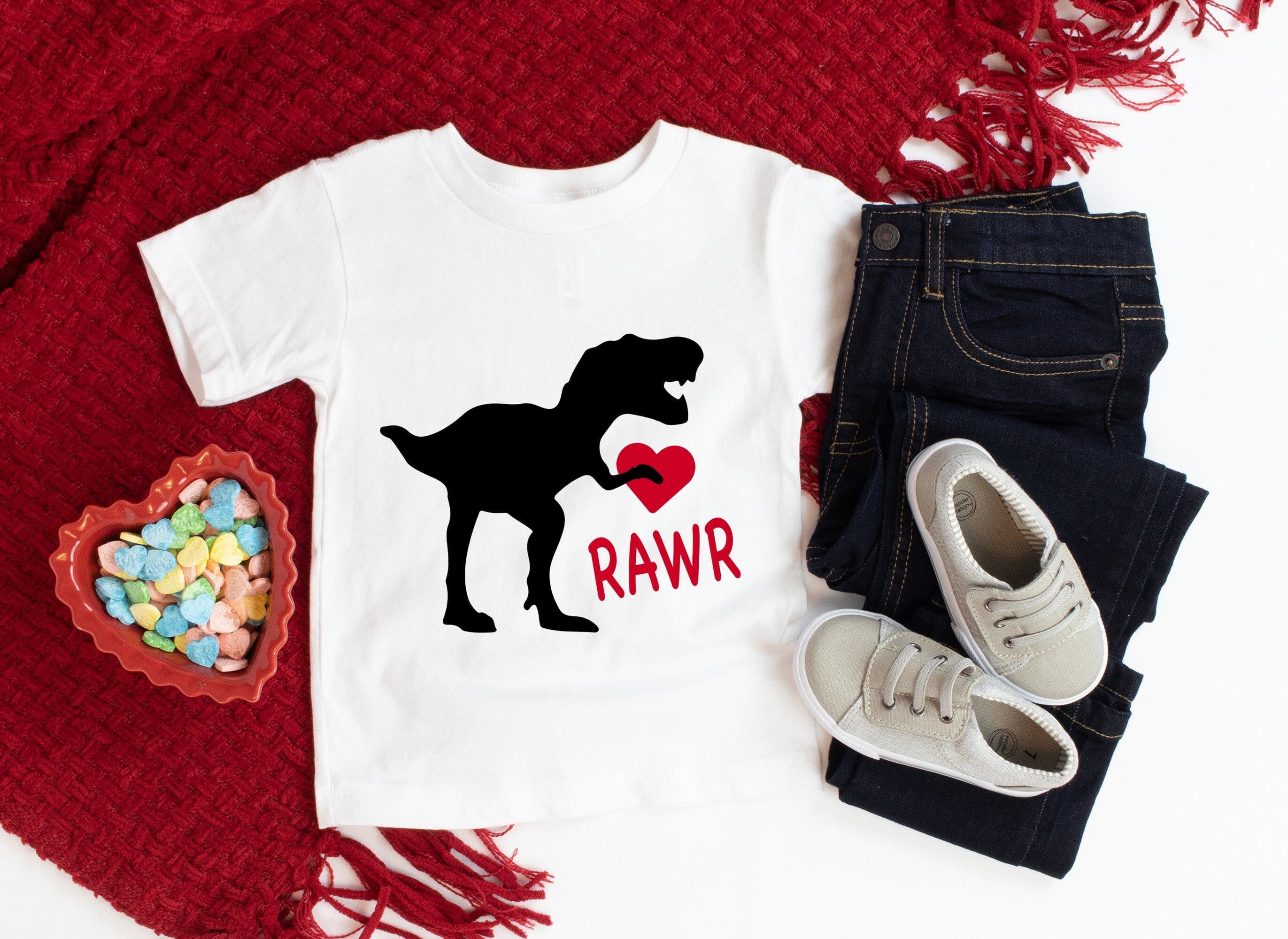 A cute Rawr Valentine Baby Tee featuring playful graphics, made from soft cotton jersey, perfect for babies.