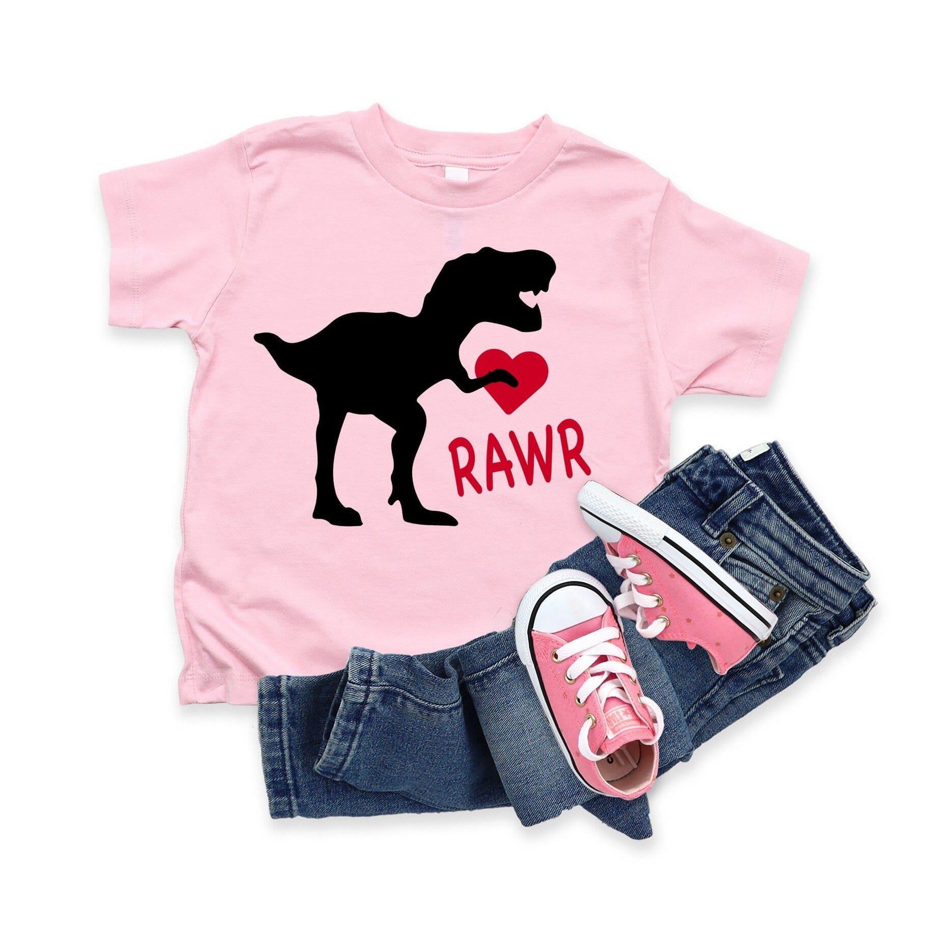 A cute toddler wearing the Rawr Valentine Tee, showcasing its vibrant design and comfortable fit.