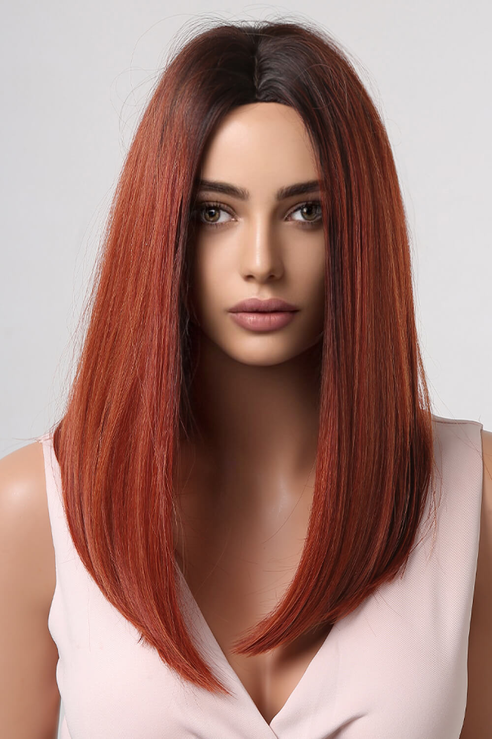 Rebecca Wig featuring mid-length synthetic hair in a straight texture, displayed on a mannequin in a studio setting.