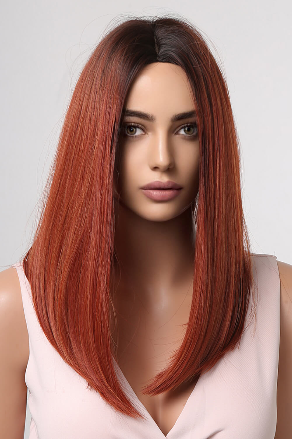 Rebecca Wig featuring mid-length synthetic hair in a straight texture, displayed on a mannequin in a studio setting.