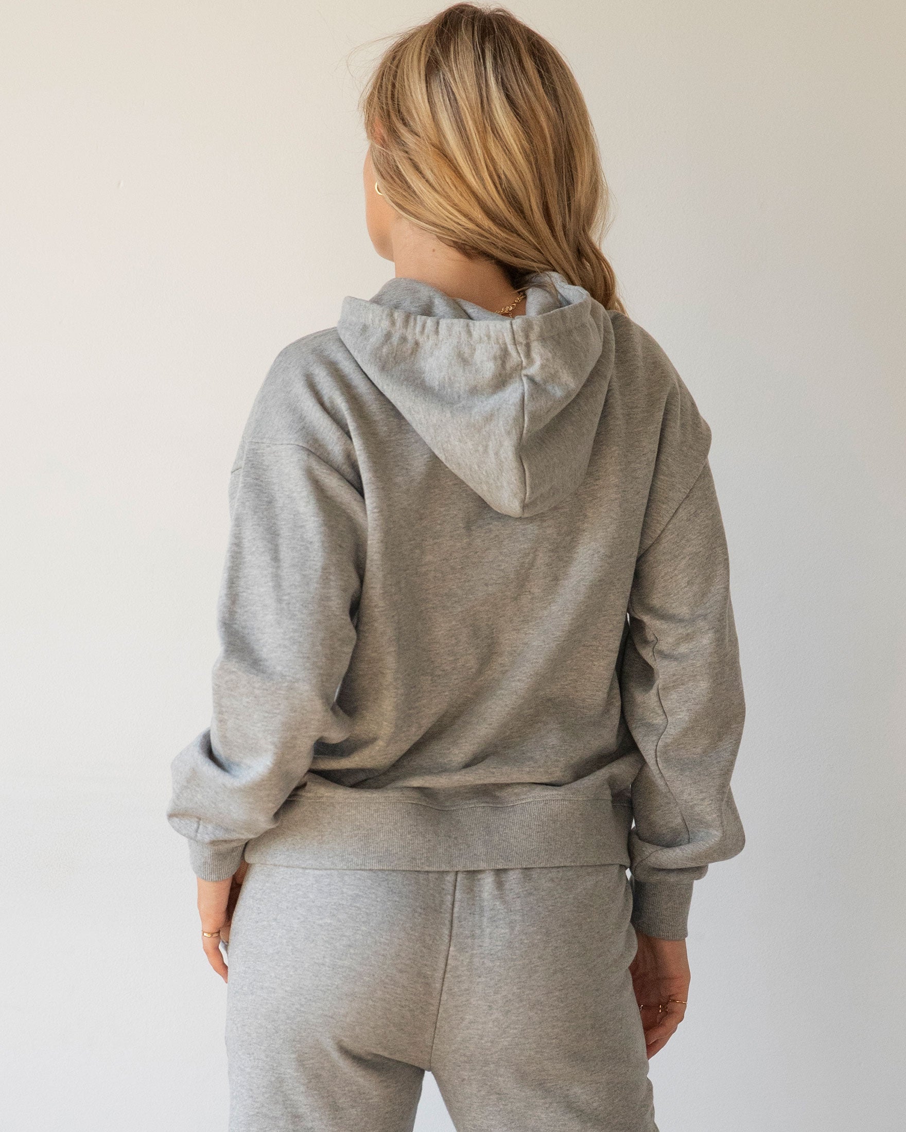 Rebody Lifestyle Hoodie in soft 100% cotton french terry fabric, featuring shoelace drawstrings and minimal branding.