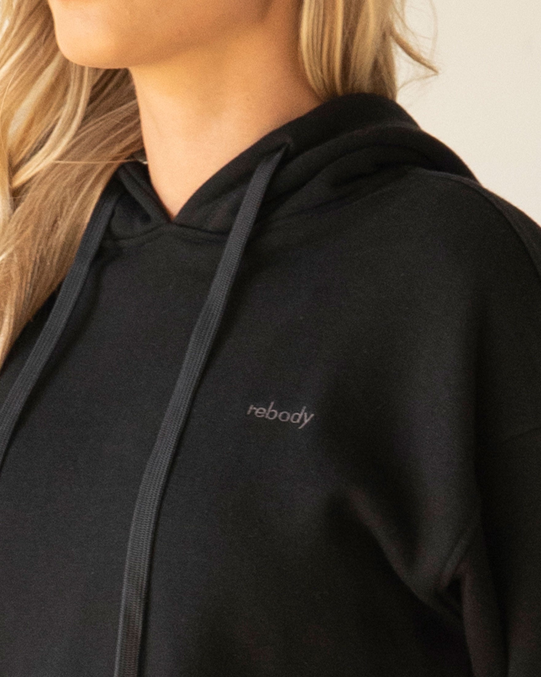 Rebody Lifestyle Hoodie in soft 100% cotton french terry fabric, featuring shoelace drawstrings and minimal branding.