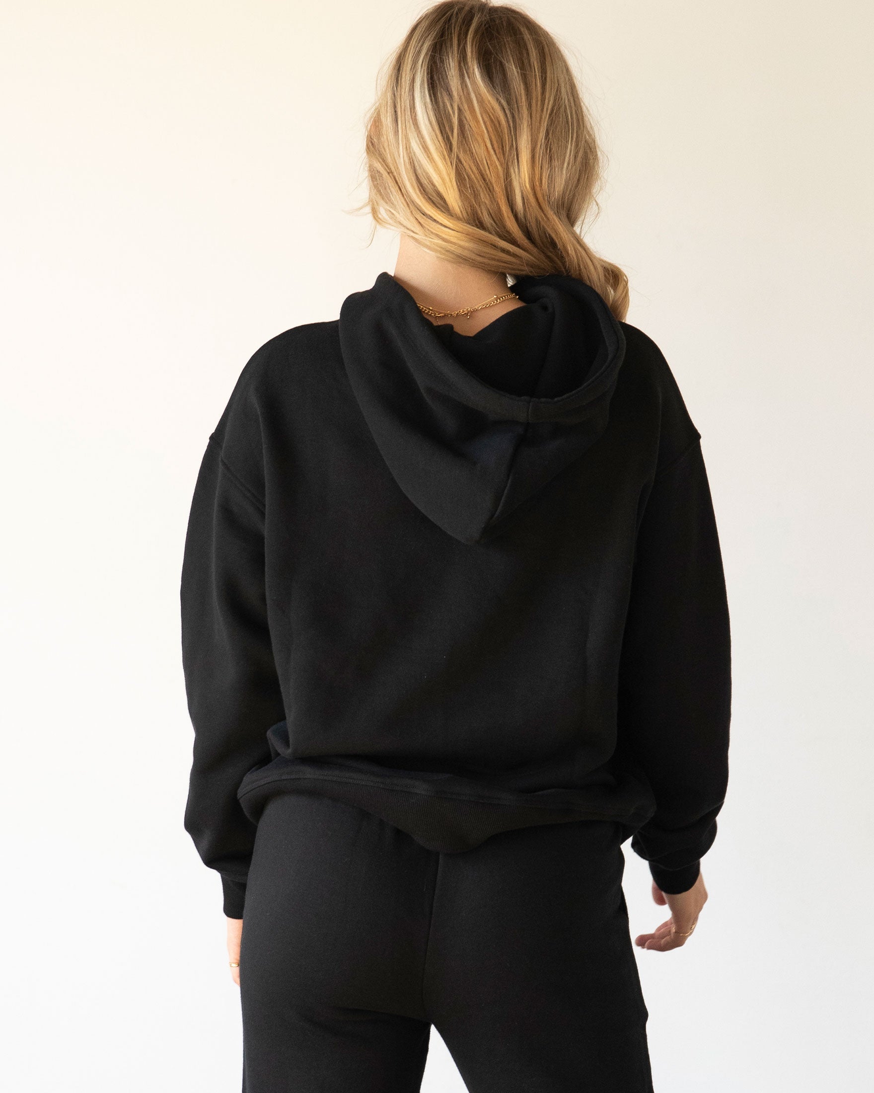 Rebody Lifestyle Hoodie in soft 100% cotton french terry fabric, featuring shoelace drawstrings and minimal branding.