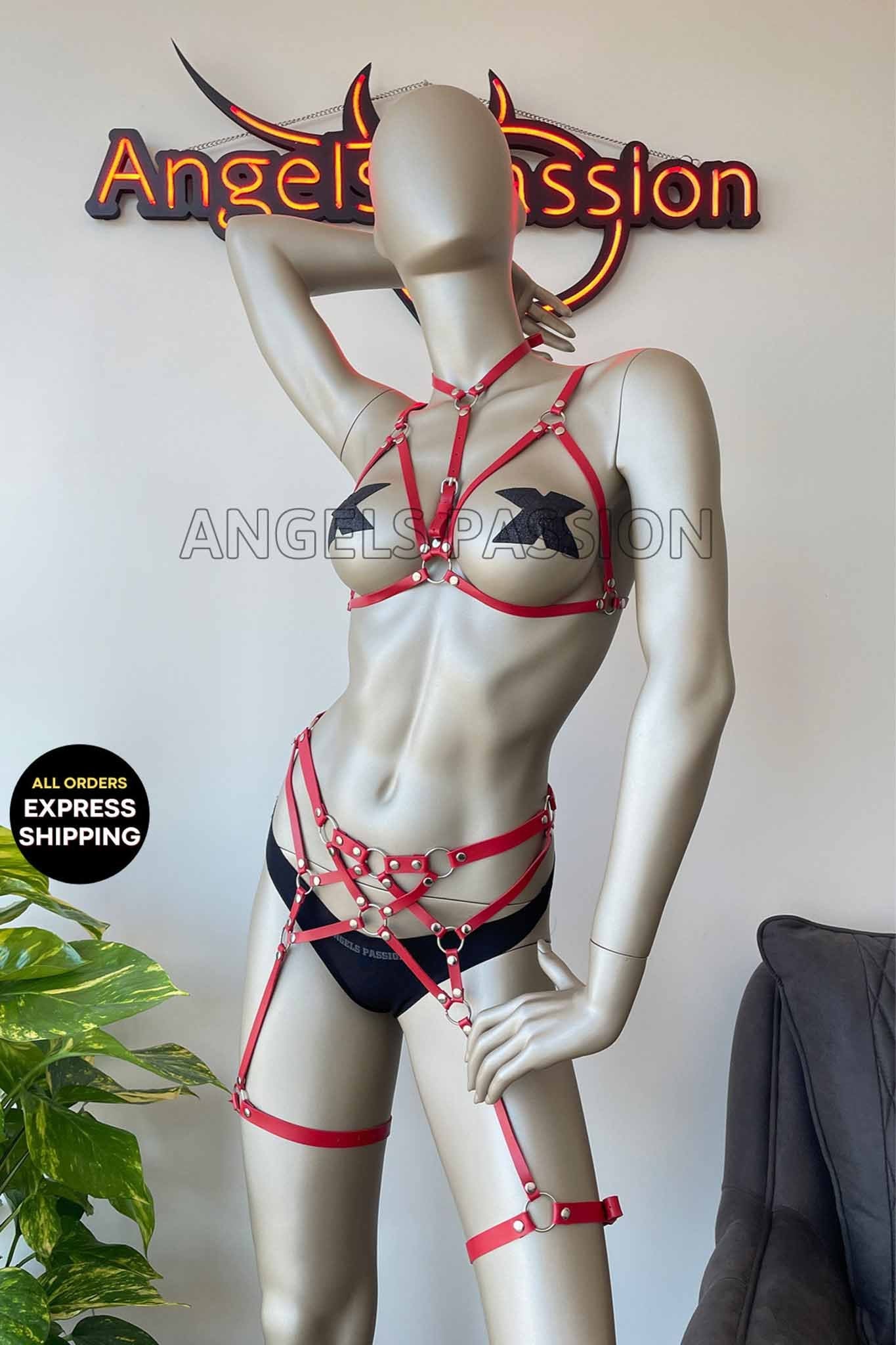 Red and black sexy bondage harness lingerie featuring flat straps and an open bra design, perfect for intimate moments.