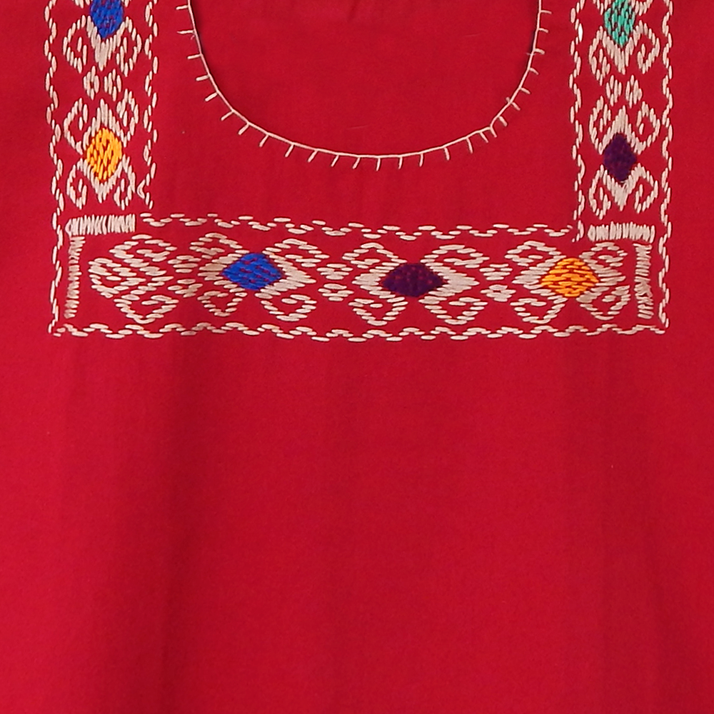 A vibrant red blouse huipil featuring colorful hand-stitched designs, showcasing traditional Mexican craftsmanship.