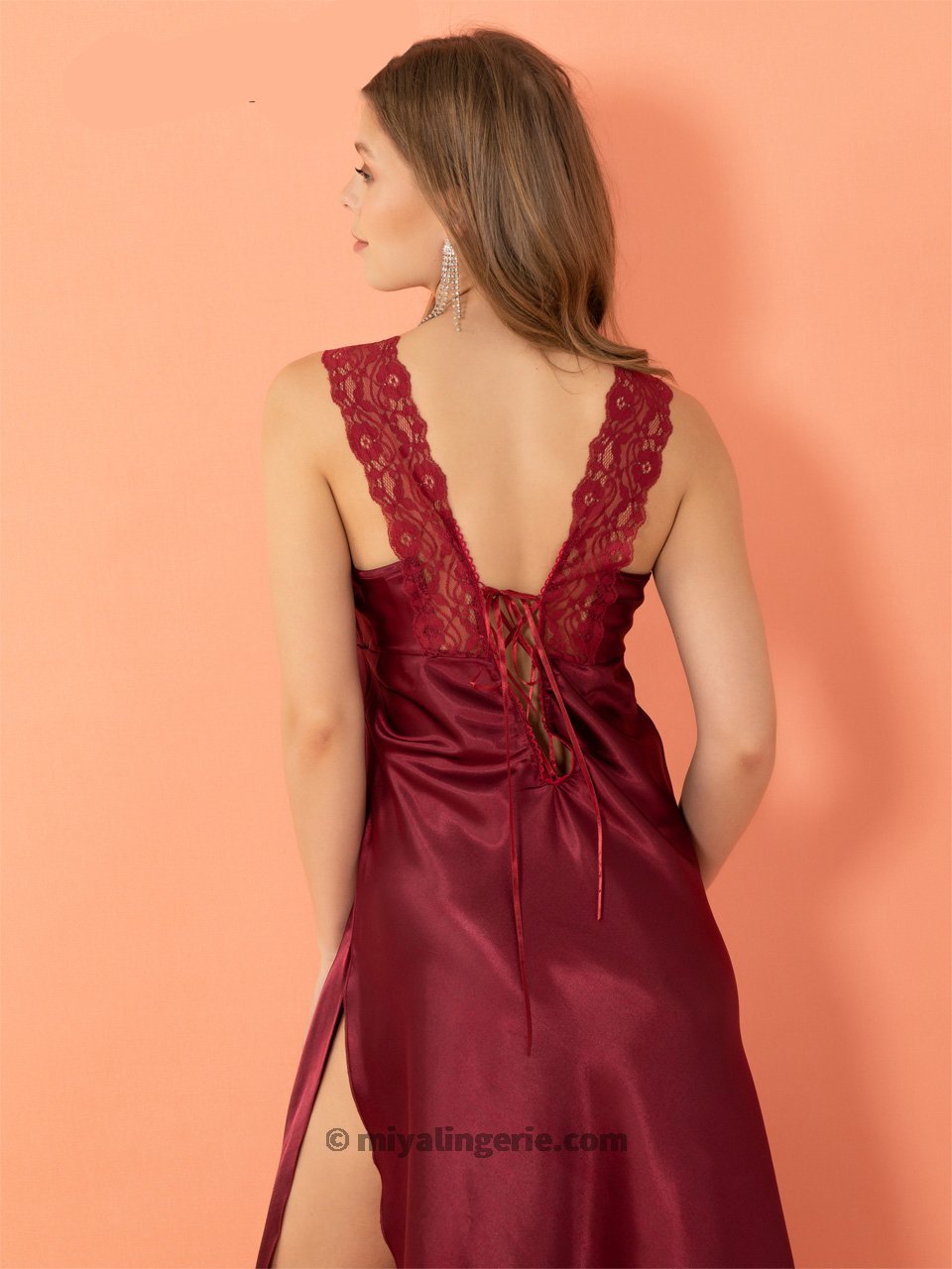 A stunning red high slit dress nightie featuring a deep V neckline, thick shoulder straps, and intricate lace detailing along the bust line.