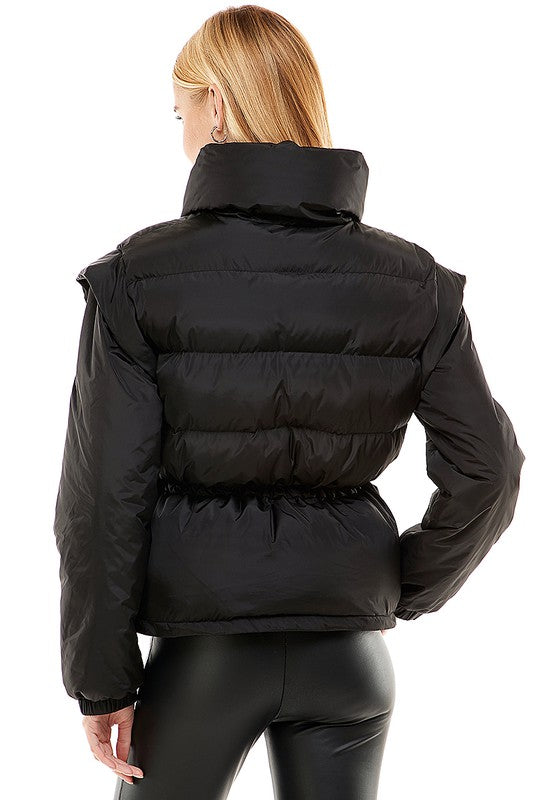 A stylish Removable Sleeve Puff Jacket with adjustable tie waist, showcasing its chic design and versatility.