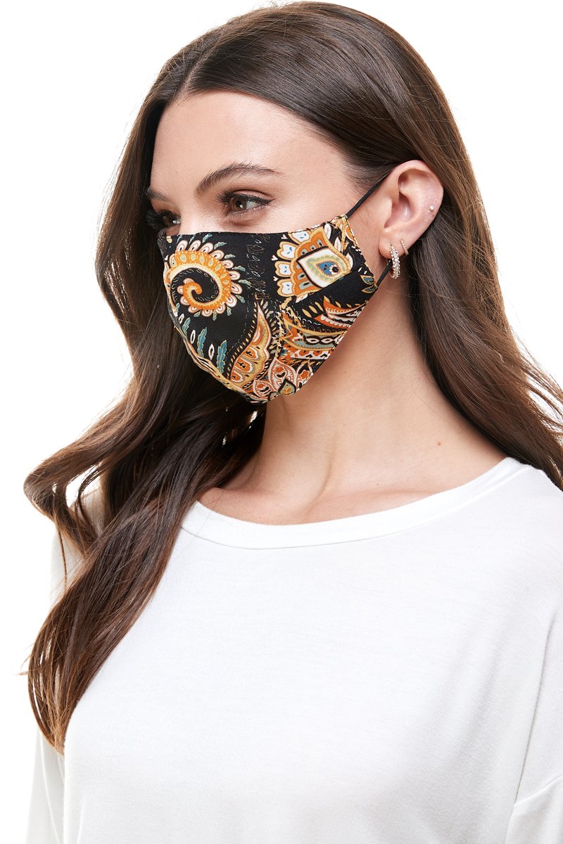 Reversible woven face mask featuring vibrant floral and tropical patterns, designed for comfort and safety.