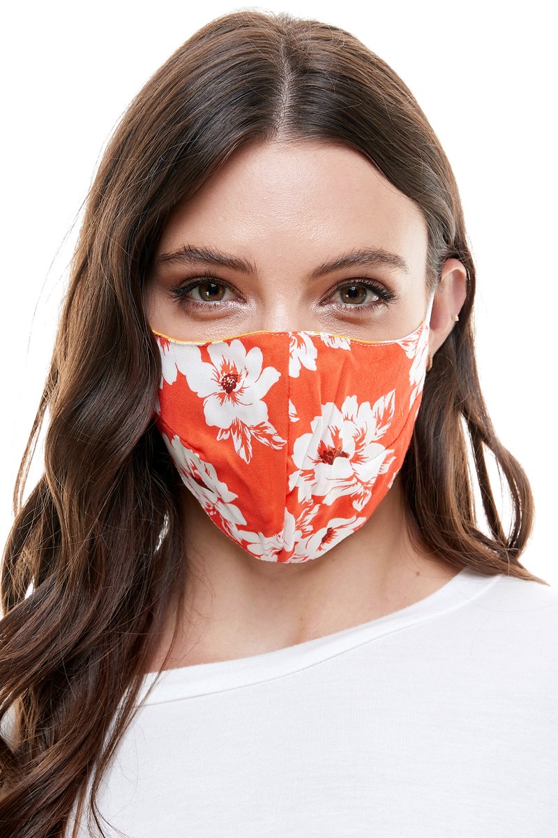 Reversible woven face mask featuring vibrant floral and tropical patterns, designed for comfort and safety.