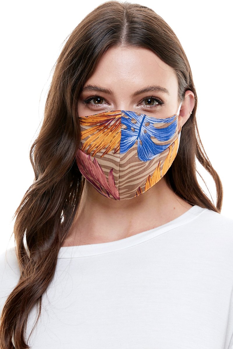 Reversible woven face mask featuring vibrant floral and tropical patterns, designed for comfort and safety.