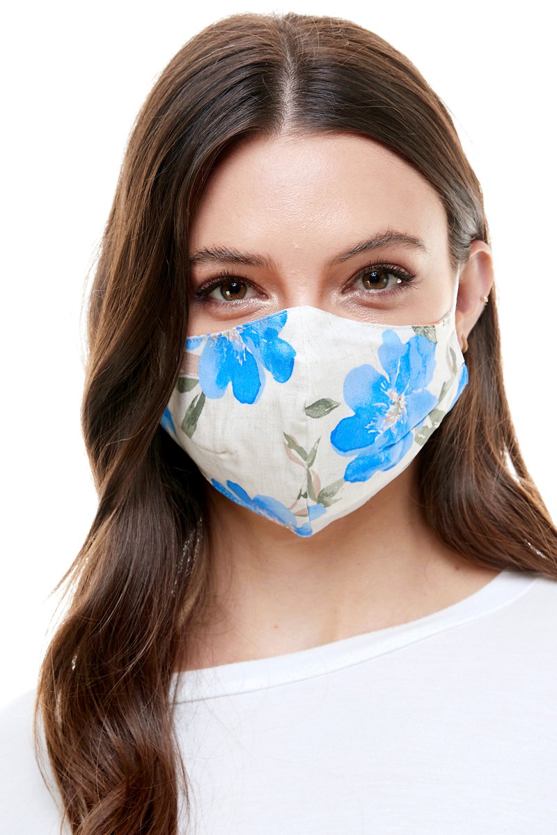 Reversible woven face mask featuring vibrant floral and tropical patterns, designed for comfort and safety.