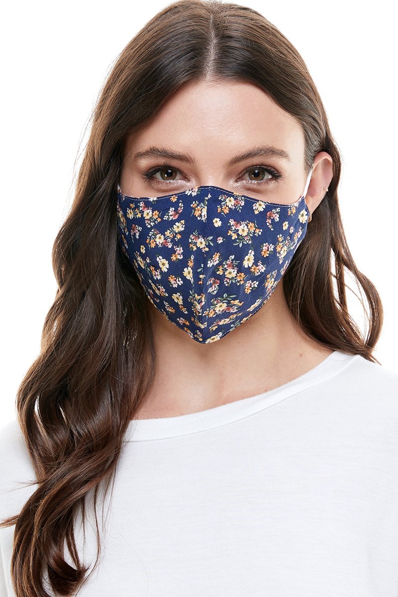 Reversible woven face mask featuring vibrant floral and tropical patterns, designed for comfort and safety.