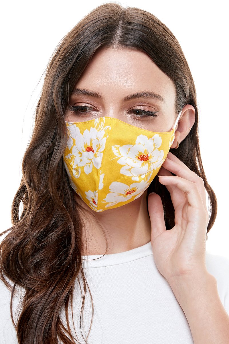 Reversible woven face mask featuring vibrant floral and tropical patterns, designed for comfort and safety.