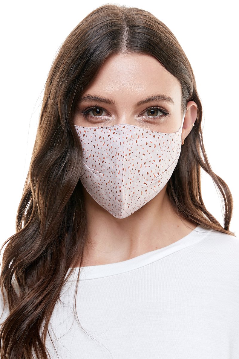 Reversible woven face mask featuring vibrant floral and tropical patterns, designed for comfort and safety.