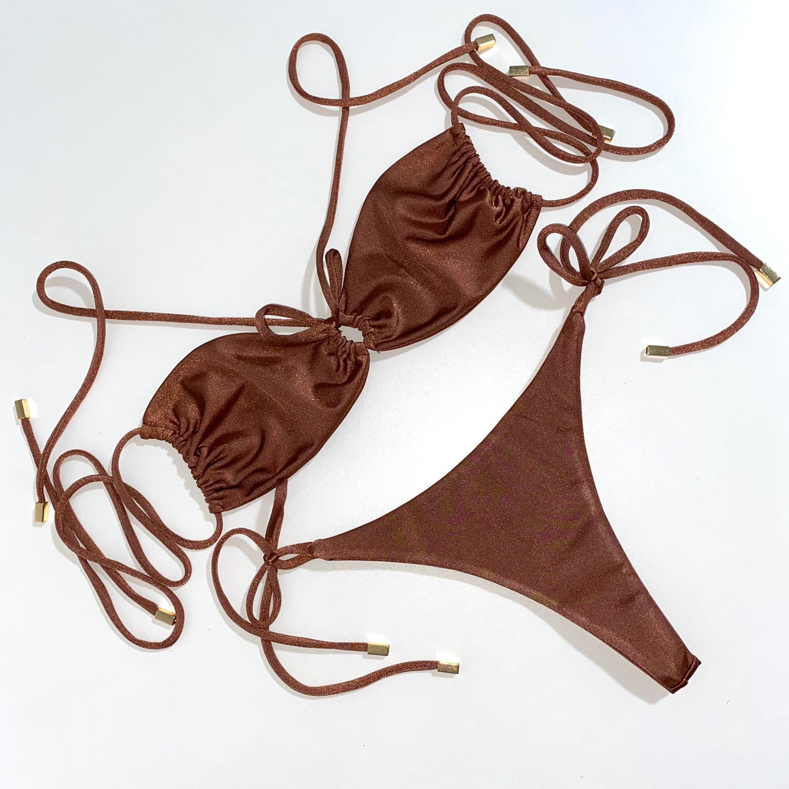 RHODE BOTTOMS in Bronze Shimmer showcasing sparkling fabric and adjustable tie string, perfect for stylish swimwear.