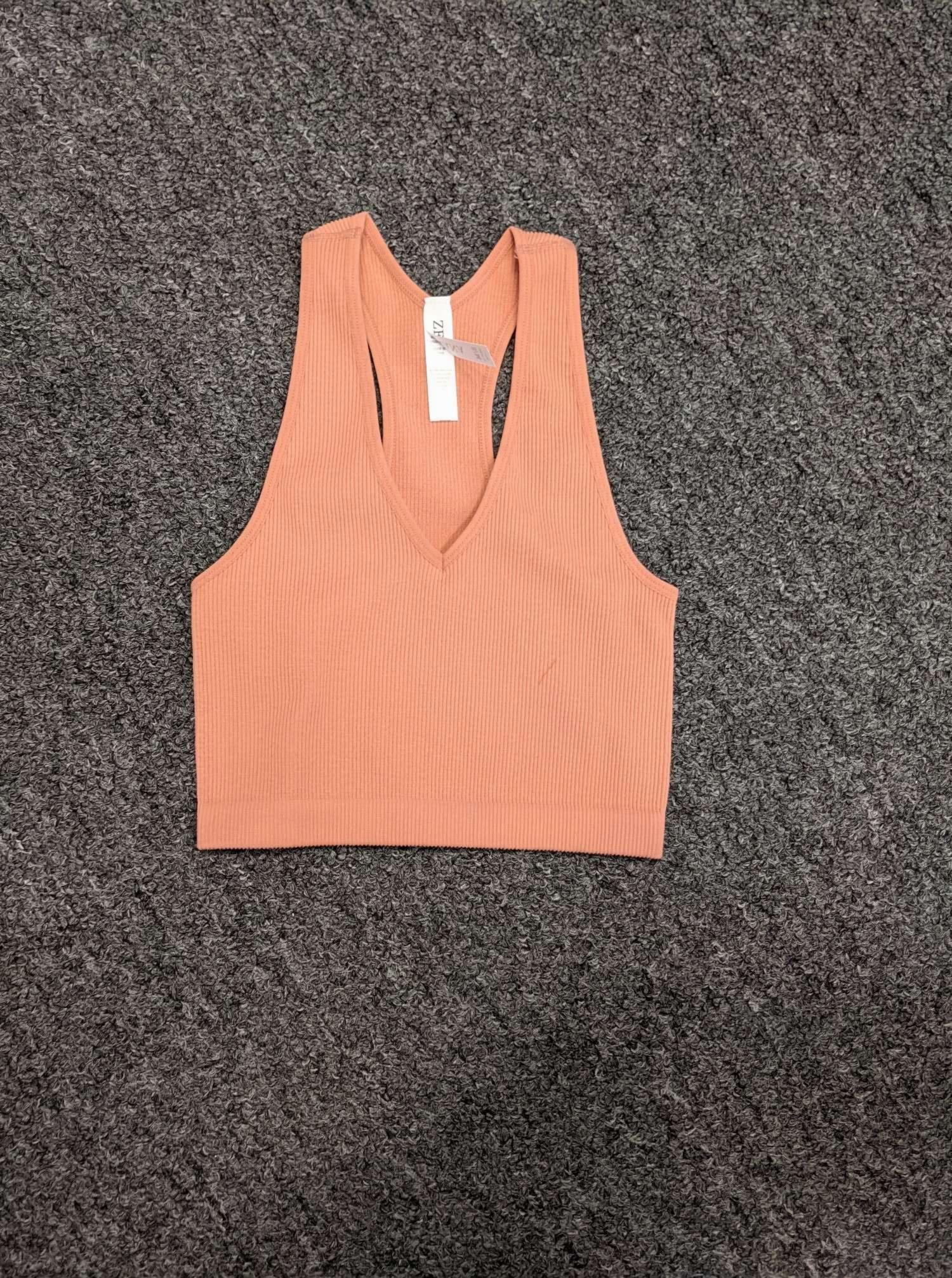 Ribbed Cropped Racerback Tank Top in various colors, showcasing its soft fabric and thick straps.