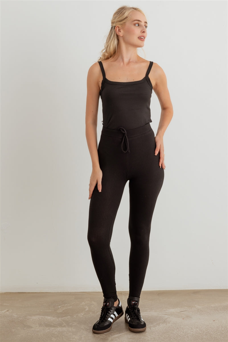 Ribbed high waist drawstring leggings in black, showcasing the elastic waist and stretchy fabric.