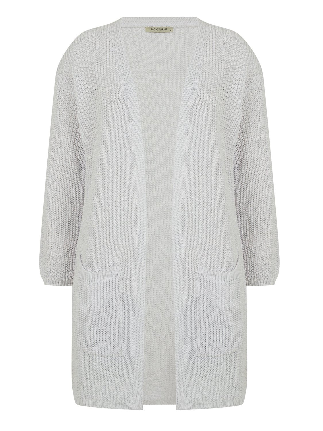 A stylish ribbed knit cardigan in a cozy setting, showcasing its long sleeves and soft texture.