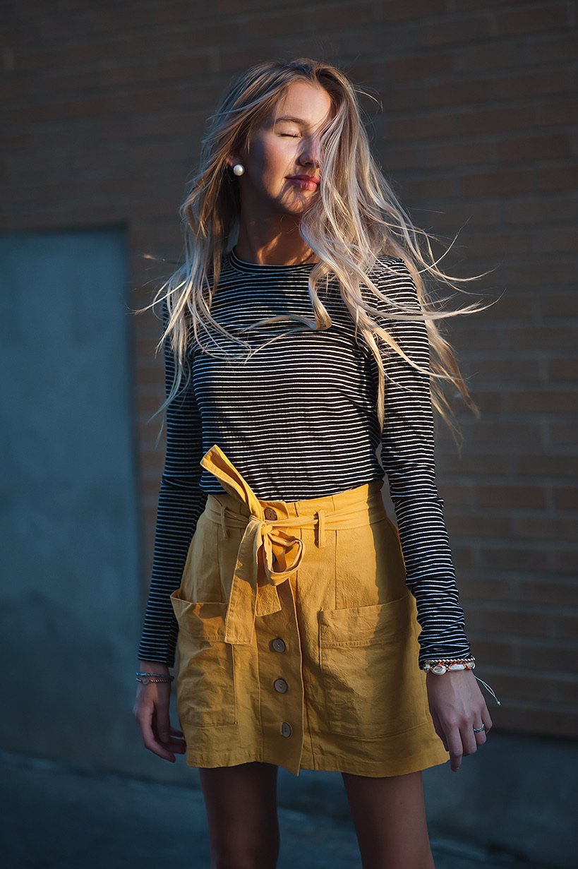 Ribbed long sleeve tee in black with white stripes, showcasing its stylish design and ribbed texture.