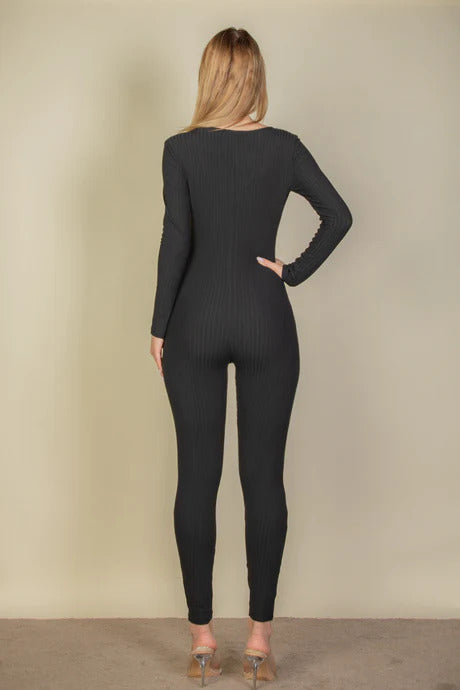 A stylish black ribbed scoop neck long sleeve jumpsuit, showcasing its soft fabric and elegant design, perfect for casual outings.