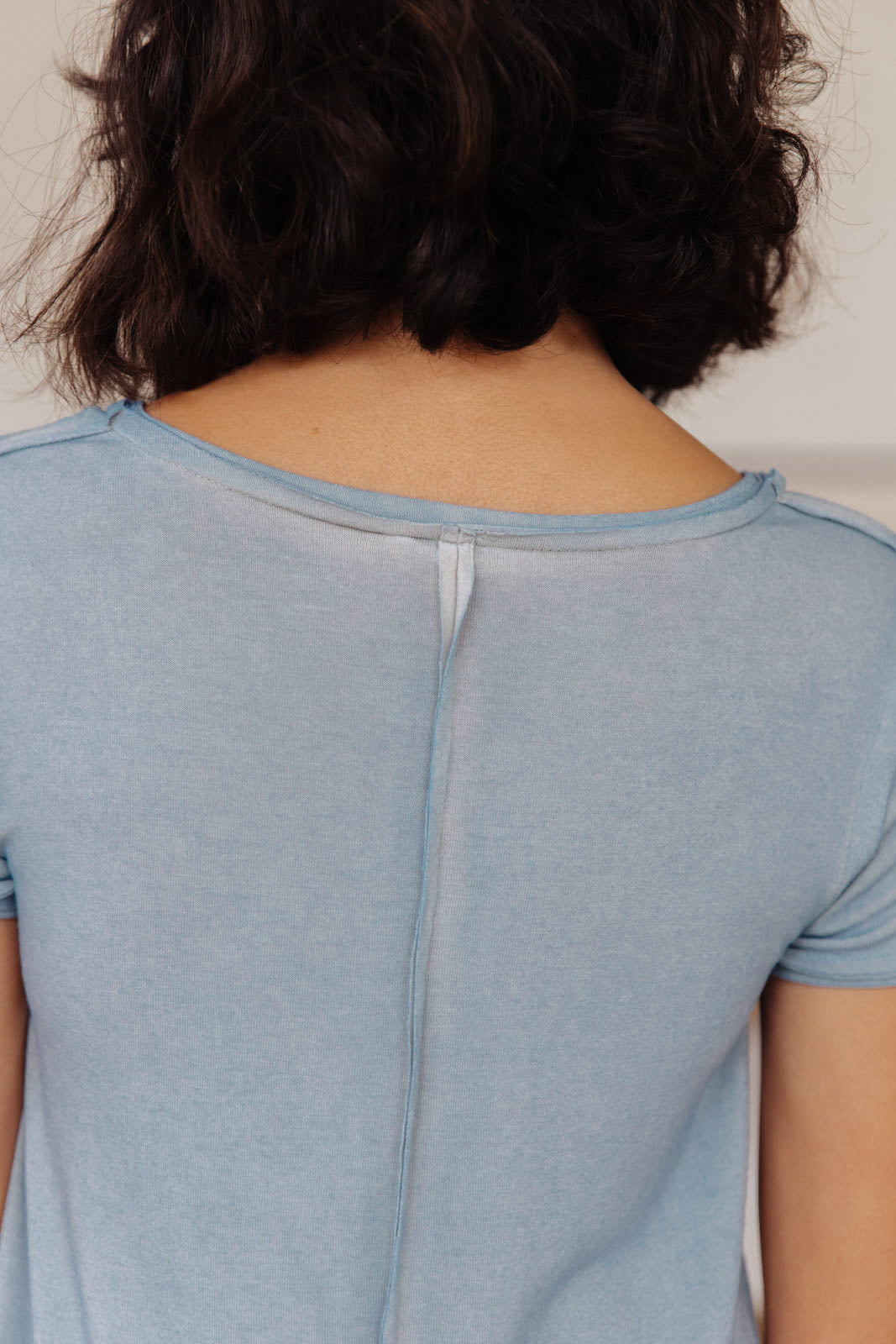 Right Side Out Top in Faded Blue featuring short sleeves and v-neckline with double fabric detail.