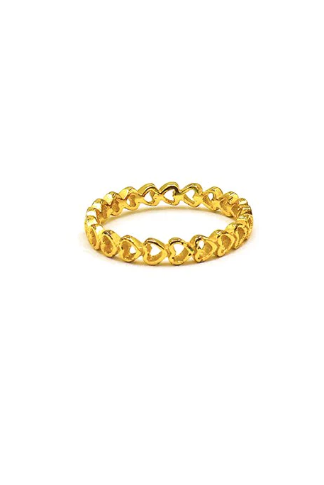 Gold-colored ring featuring delicate mini heart designs, crafted from silver, showcasing elegance and charm.