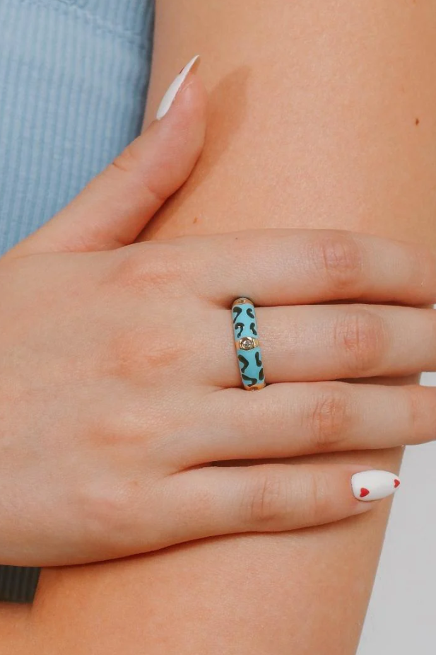 Elegant blue ring with decorative diamonds and intricate print design, item code ART2221.