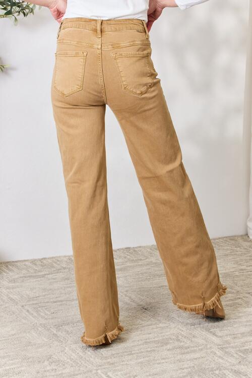 RISEN Full Size Fringe Hem Wide Leg Jeans featuring a high-waisted fit and trendy wide-leg design, perfect for casual and dressed-up occasions.