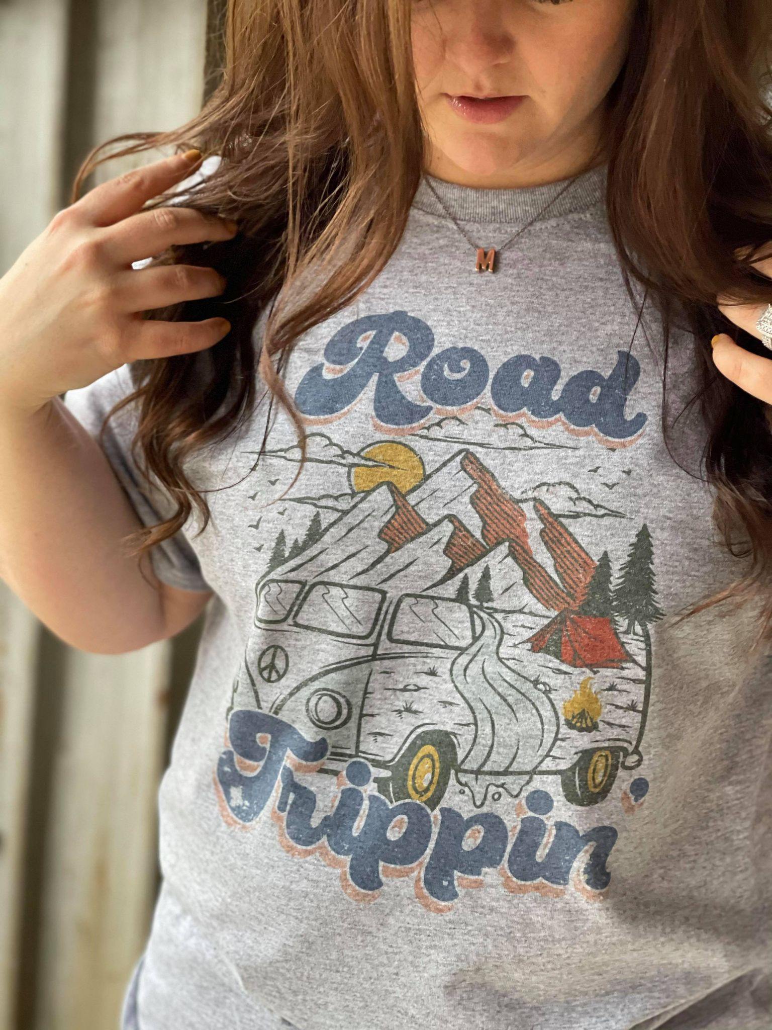 A stylish Road Trippin' Tee featuring a soft unisex fit and vibrant sublimated design, perfect for casual outings.